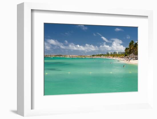 Vacationers along Palm Beach in Aruba-raphoto-Framed Photographic Print