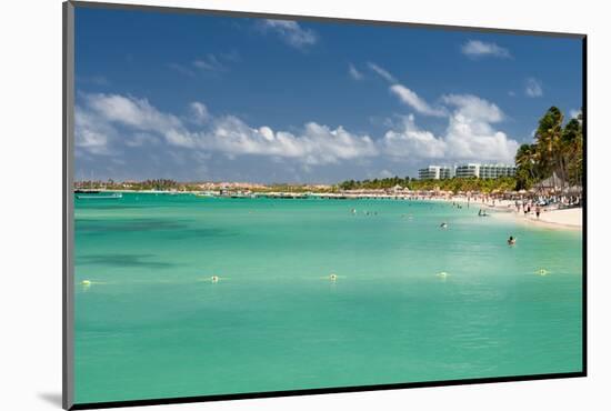 Vacationers along Palm Beach in Aruba-raphoto-Mounted Photographic Print