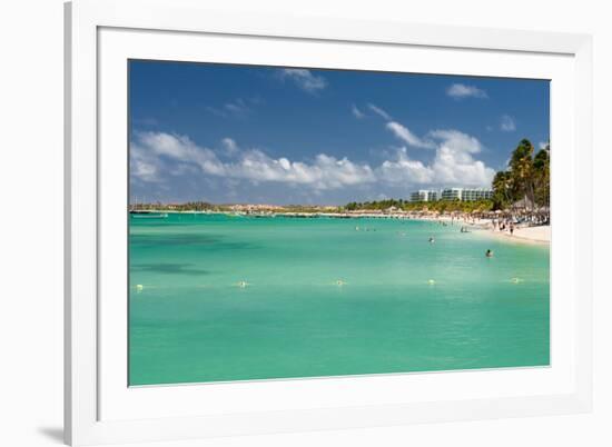 Vacationers along Palm Beach in Aruba-raphoto-Framed Photographic Print