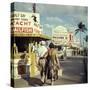 Vacationers Walking by Booths Advertising Boat Tours-Hank Walker-Stretched Canvas