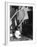 Vacuuming with a Chimp-null-Framed Photographic Print