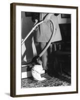 Vacuuming with a Chimp-null-Framed Photographic Print