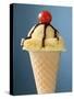 Vanilla Ice Cream Cone with Chocolate Sauce and Cocktail Cherry-null-Stretched Canvas