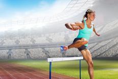 Digital Composite Image of Female Athlete Jumping above the Hurdle against Cityscape Background-vectorfusionart-Framed Stretched Canvas