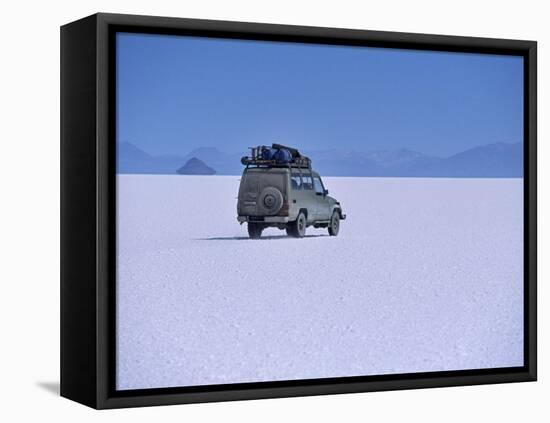 Vehicle Drives across the Crusted Salt of the Salar De Uyuni, the Largest Salt Flat in the World-John Warburton-lee-Framed Stretched Canvas