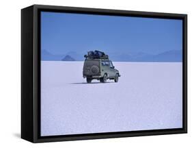 Vehicle Drives across the Crusted Salt of the Salar De Uyuni, the Largest Salt Flat in the World-John Warburton-lee-Framed Stretched Canvas