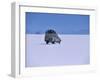 Vehicle Drives across the Crusted Salt of the Salar De Uyuni, the Largest Salt Flat in the World-John Warburton-lee-Framed Photographic Print