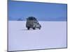 Vehicle Drives across the Crusted Salt of the Salar De Uyuni, the Largest Salt Flat in the World-John Warburton-lee-Mounted Photographic Print