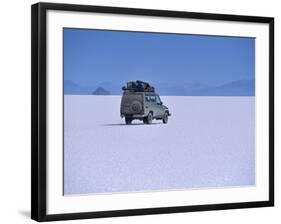 Vehicle Drives across the Crusted Salt of the Salar De Uyuni, the Largest Salt Flat in the World-John Warburton-lee-Framed Photographic Print