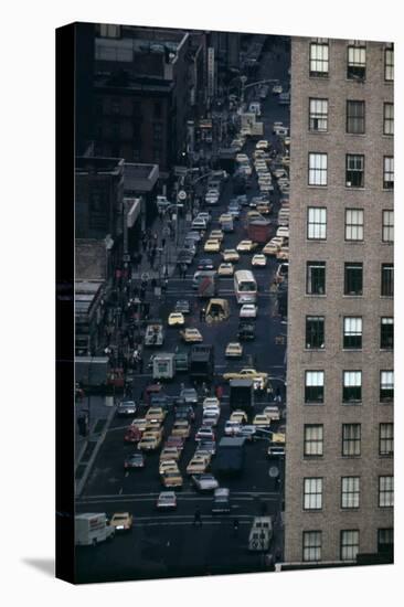Vehicles on Manhattan's Sixth Avenue at 42nd Street in NYC in 1970s-null-Stretched Canvas