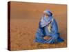 Veiled Tuareg Man Sitting Cross-Legged on the Sand, Erg Chebbi, Morocco-null-Stretched Canvas