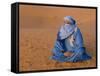 Veiled Tuareg Man Sitting Cross-Legged on the Sand, Erg Chebbi, Morocco-null-Framed Stretched Canvas