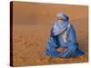 Veiled Tuareg Man Sitting Cross-Legged on the Sand, Erg Chebbi, Morocco-null-Stretched Canvas