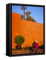 Veiled Woman Bicycling Below Red City Walls, Marrakech, Morocco-Merrill Images-Framed Stretched Canvas