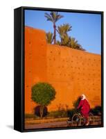 Veiled Woman Bicycling Below Red City Walls, Marrakech, Morocco-Merrill Images-Framed Stretched Canvas