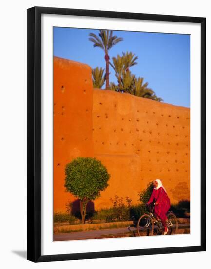 Veiled Woman Bicycling Below Red City Walls, Marrakech, Morocco-Merrill Images-Framed Premium Photographic Print