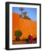 Veiled Woman Bicycling Below Red City Walls, Marrakech, Morocco-Merrill Images-Framed Photographic Print