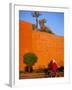 Veiled Woman Bicycling Below Red City Walls, Marrakech, Morocco-Merrill Images-Framed Photographic Print