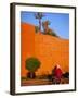 Veiled Woman Bicycling Below Red City Walls, Marrakech, Morocco-Merrill Images-Framed Photographic Print