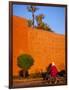 Veiled Woman Bicycling Below Red City Walls, Marrakech, Morocco-Merrill Images-Framed Photographic Print