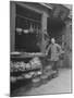 Vendor Standing Next to Vegetables, Eggs and Spices for Sale at Provision Market in Chinatown-null-Mounted Photographic Print