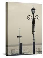 Veneto, Lake District, Lake Garda, Garda, Lakeside Pier View, Italy-Walter Bibikow-Stretched Canvas