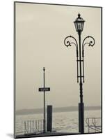 Veneto, Lake District, Lake Garda, Garda, Lakeside Pier View, Italy-Walter Bibikow-Mounted Photographic Print