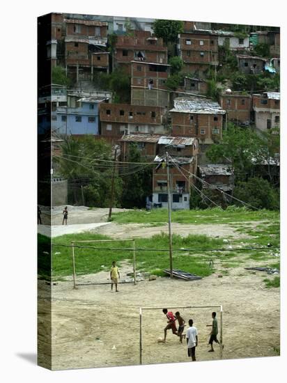 Venezuelan Children Play Soccer at the Resplandor Shantytown-null-Stretched Canvas