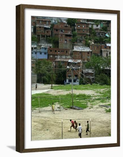 Venezuelan Children Play Soccer at the Resplandor Shantytown-null-Framed Premium Photographic Print