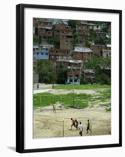 Venezuelan Children Play Soccer at the Resplandor Shantytown-null-Framed Premium Photographic Print