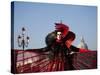 Venice, Veneto, Italy, a Mask in Costume on the Bacino Di San Marco with the Cupola of Santa Maria -Ken Scicluna-Stretched Canvas