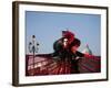 Venice, Veneto, Italy, a Mask in Costume on the Bacino Di San Marco with the Cupola of Santa Maria -Ken Scicluna-Framed Photographic Print