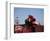 Venice, Veneto, Italy, a Mask in Costume on the Bacino Di San Marco with the Cupola of Santa Maria -Ken Scicluna-Framed Photographic Print