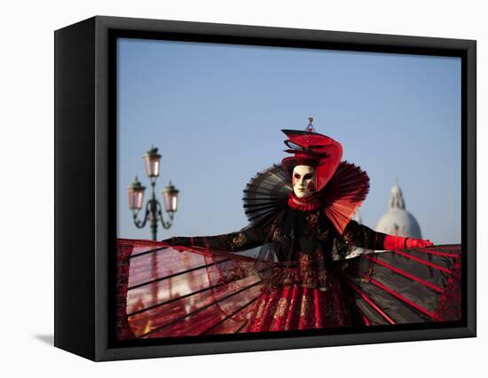 Venice, Veneto, Italy, a Mask in Costume on the Bacino Di San Marco with the Cupola of Santa Maria -Ken Scicluna-Framed Stretched Canvas