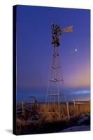 Venus and Jupiter are Visible Behind an Old Farm Water Pump Windmill, Alberta, Canada-null-Stretched Canvas