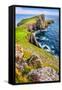 Vertical View of Neist Point Lighthouse and Rocky Ocean Coastline, Scotland-MartinM303-Framed Stretched Canvas
