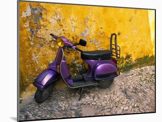 Vespa and Yellow Wall in Old Town, Rhodes, Greece-Tom Haseltine-Mounted Photographic Print