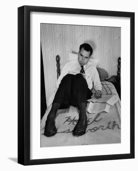 Vice Presidential Candidate Richard M. Nixon Sitting on His Hotel Bed Reviewing Paperwork-Cornell Capa-Framed Photographic Print