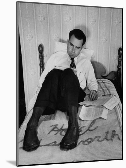Vice Presidential Candidate Richard M. Nixon Sitting on His Hotel Bed Reviewing Paperwork-Cornell Capa-Mounted Photographic Print