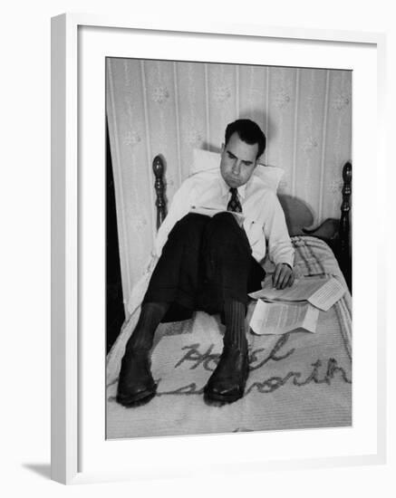 Vice Presidential Candidate Richard M. Nixon Sitting on His Hotel Bed Reviewing Paperwork-Cornell Capa-Framed Photographic Print