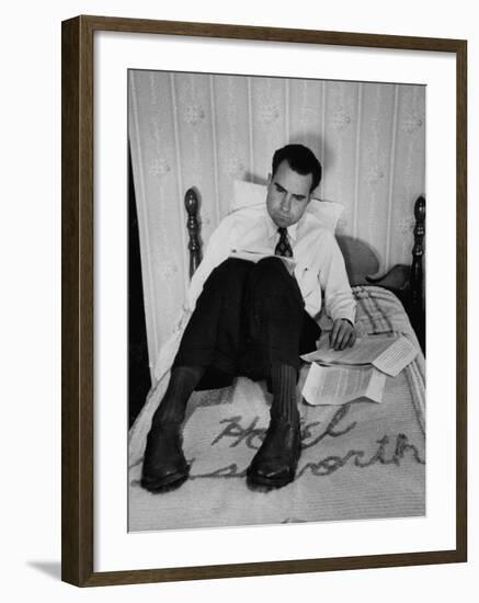 Vice Presidential Candidate Richard M. Nixon Sitting on His Hotel Bed Reviewing Paperwork-Cornell Capa-Framed Photographic Print