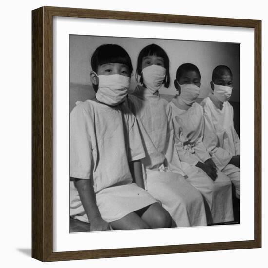 Victims of a Bomb in Hiroshima Waiting to Be Examined by A.B.C.C-Carl Mydans-Framed Photographic Print