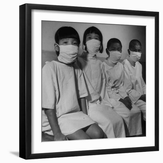 Victims of a Bomb in Hiroshima Waiting to Be Examined by A.B.C.C-Carl Mydans-Framed Photographic Print