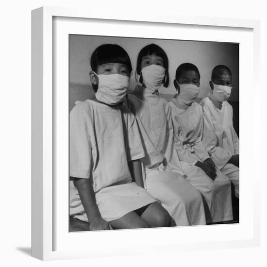 Victims of a Bomb in Hiroshima Waiting to Be Examined by A.B.C.C-Carl Mydans-Framed Photographic Print