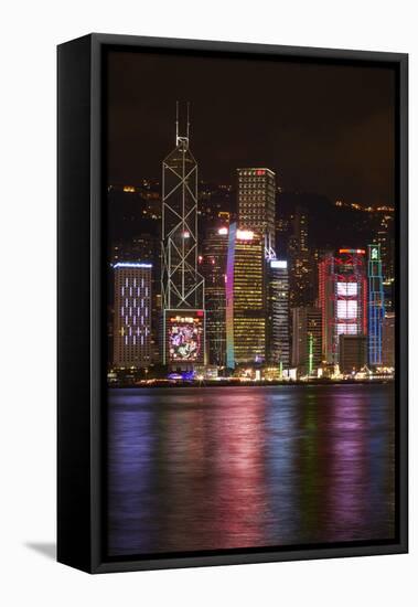 Victoria Harbor and light show on skyscrapers, Central, Hong Kong, China-David Wall-Framed Stretched Canvas
