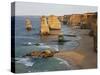 Victoria, Some of Twelve Apostles Standing in Shallow Water, Port Campbell National Park, Australia-Nigel Pavitt-Stretched Canvas