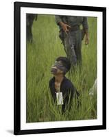 Viet Cong Prisoner Being Guarded by Marines, Mouth and Eyes Taped to Prevent From Calling for Help-Paul Schutzer-Framed Photographic Print