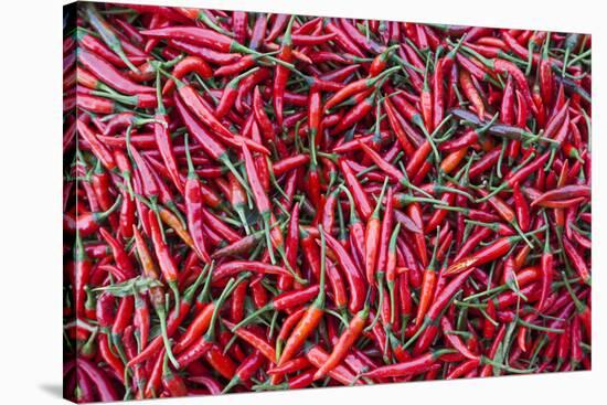 Vietnam, Dien Bien Phu. City Market, Chilies-Walter Bibikow-Stretched Canvas