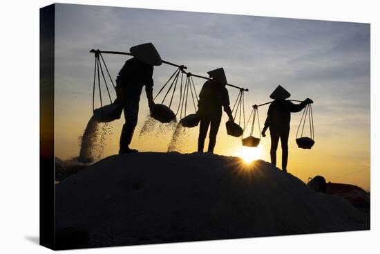 Vietnam. Doc Let Salt lake. Workers harvesting the salt. Early morning sunrise.-Tom Norring-Stretched Canvas