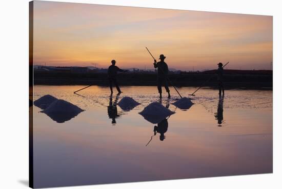 Vietnam. Doc Let Salt lake. Workers harvesting the salt. Early morning sunrise.-Tom Norring-Stretched Canvas